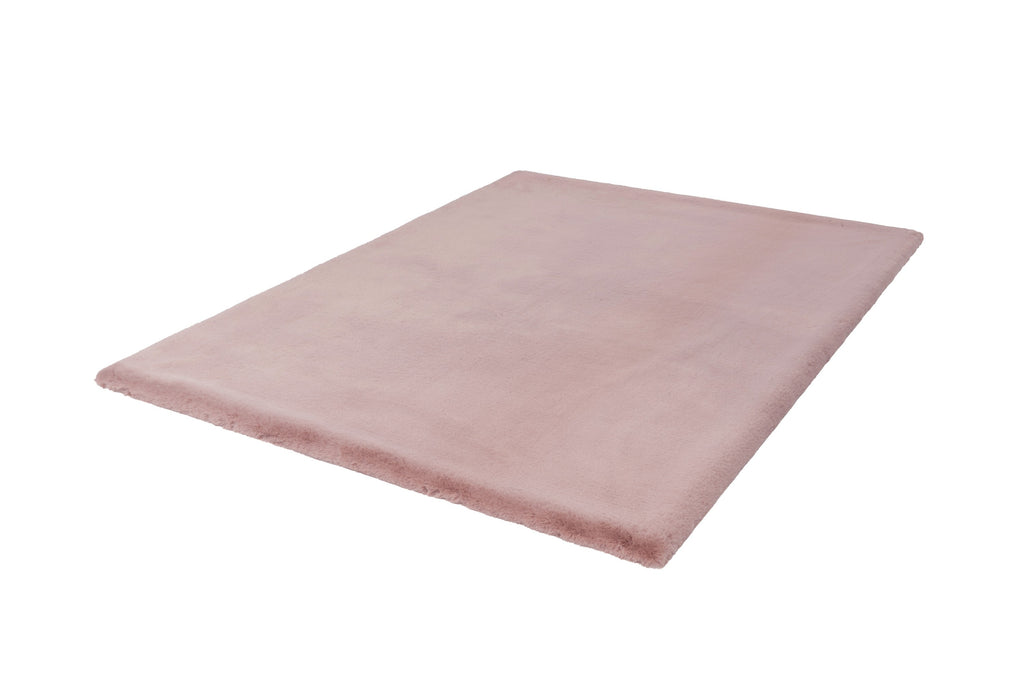 Bovenaanzicht van het vloerkleed in zachte roze tint, met organische vormen