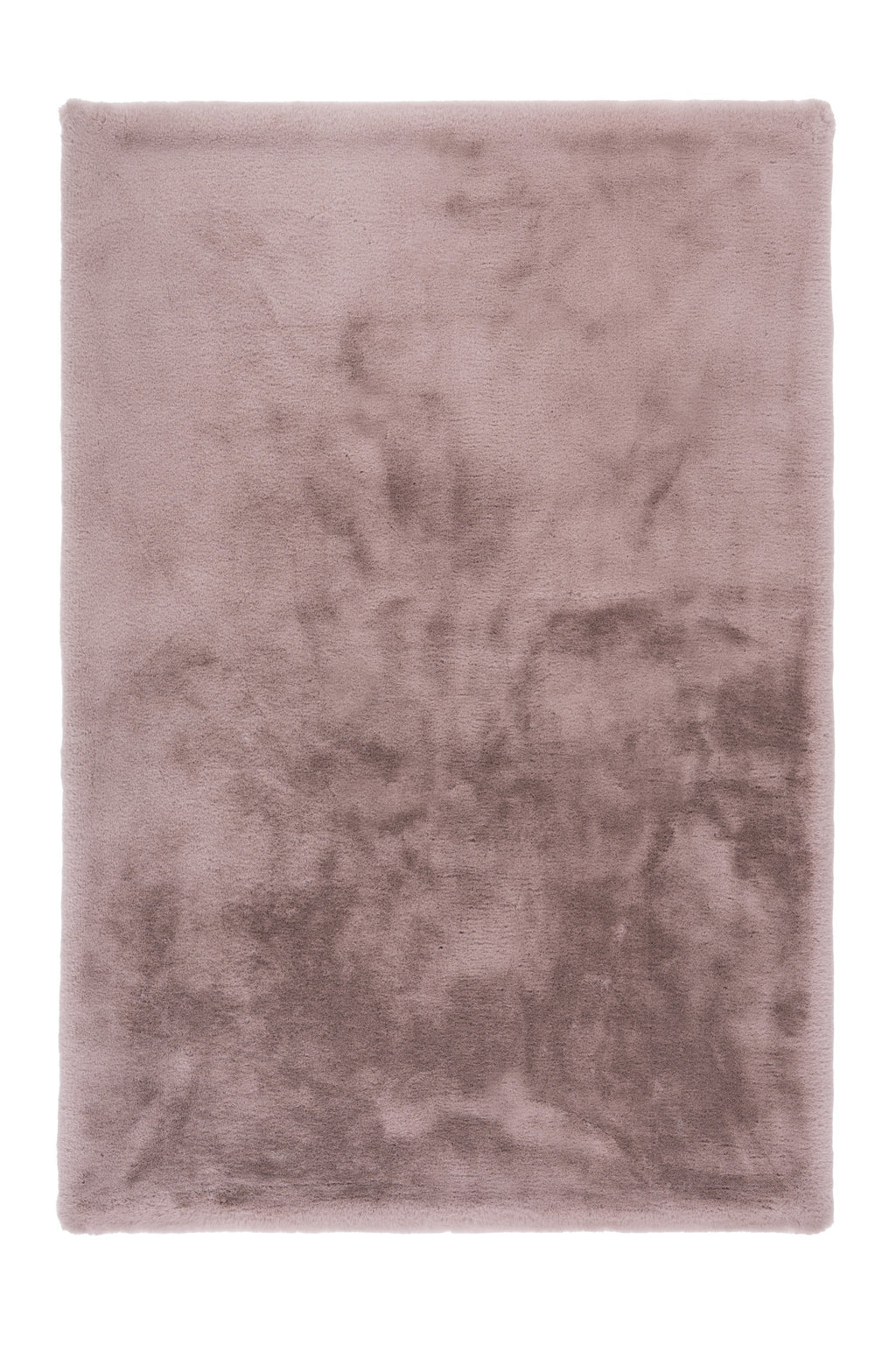 Zachtroze Cloud vloerkleed elegant uitgespreid, met zicht op de ronde lijnen en textuur