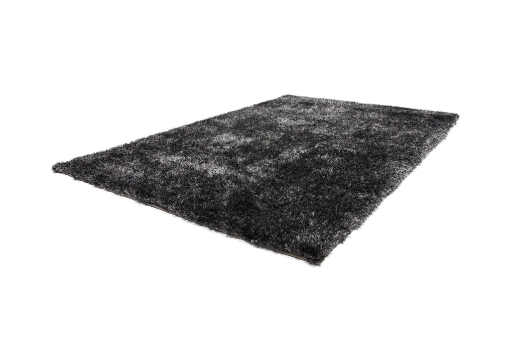 Zijaanzicht van antraciet Softwave vloerkleed met focus op textuur en dikte